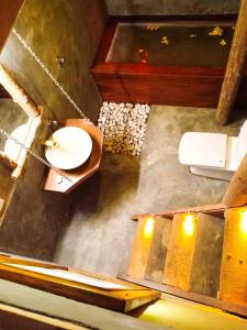 an overhead view of a bathroom with a toilet at girilena resort in Dambulla