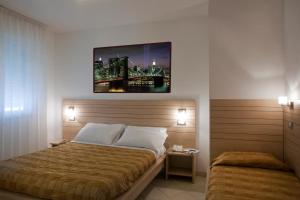 A bed or beds in a room at Residence Il Tulipano