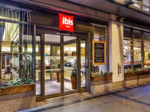 a store front of a store with a sign on it at ibis London City - Shoreditch in London