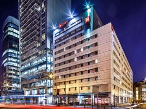 a tall building in a city at night at ibis London City - Shoreditch in London