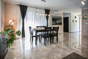 a dining room with a table and chairs at Townhouse on Budapest border in Budaörs