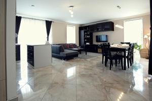 a living room with a table and a dining room at Townhouse on Budapest border in Budaörs