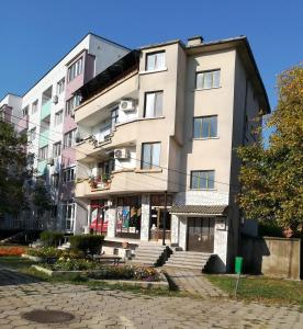 a tall building with stairs in front of it at Апартамент за гости"Вълчанови" in Elkhovo