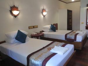 En eller flere senger på et rom på KMA Bagan Hotel