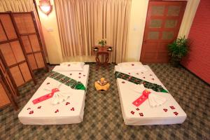 En eller flere senger på et rom på KMA Bagan Hotel
