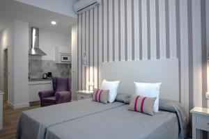 Posteľ alebo postele v izbe v ubytovaní Hotel Apartamentos MPD