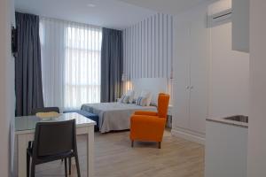 Posteľ alebo postele v izbe v ubytovaní Hotel Apartamentos MPD