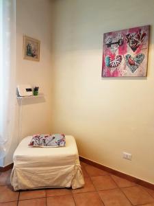 A bed or beds in a room at Il Salotto di via Giulia
