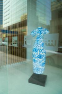 a blue and white vase in front of a window at IW Hotel in Hong Kong