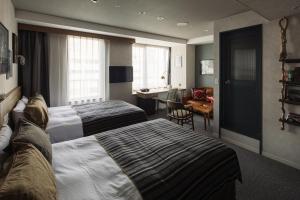 Postel nebo postele na pokoji v ubytování Hotel The Knot Yokohama