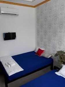 Łóżko lub łóżka w pokoju w obiekcie Hanh Phat 2 Guesthouse