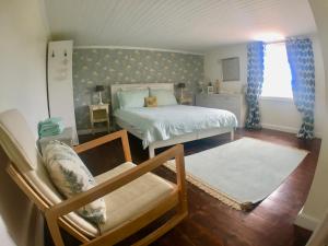 Maison Tranquil tesisinde bir odada yatak veya yataklar