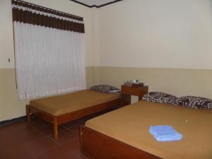 Katil atau katil-katil dalam bilik di Kahyuna Guesthouse