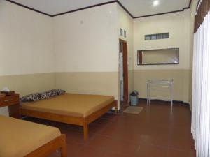 Katil atau katil-katil dalam bilik di Kahyuna Guesthouse