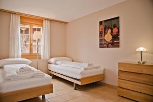 Säng eller sängar i ett rum på Apartment Paradise - GRIWA RENT AG