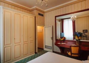 Postel nebo postele na pokoji v ubytování Grand Hotel Excelsior
