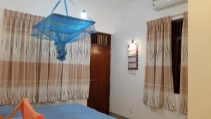 Voodi või voodid majutusasutuse Sudarshi's Home toas