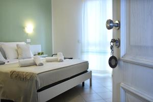 Postel nebo postele na pokoji v ubytování Hotel Stella D'Oro