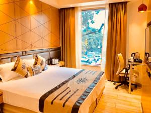 Postel nebo postele na pokoji v ubytování JRD Pride-Business Hotel + 37 fotografií