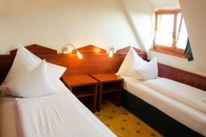 Postel nebo postele na pokoji v ubytování Hotel Fortna