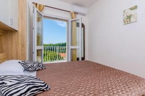Postel nebo postele na pokoji v ubytování Villa Dalmatian Gem