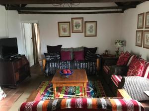 Posezení v ubytování Carneddie Cottage - main