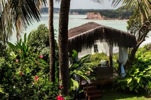 a resort with a view of the beach and the ocean at Hotel Ponta do Madeiro in Pipa