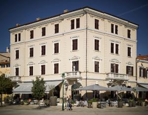 
a large building with a large window on the side of it at Hotel Adriatic in Rovinj

