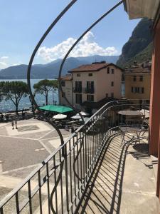 a balcony with a view of the water at Suites Menaggio in Menaggio