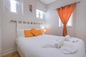 Giường trong phòng chung tại Cozy Flat in the Heart of Alfama