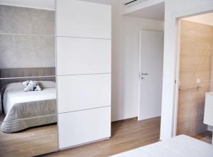 A bed or beds in a room at RomAmourHouse