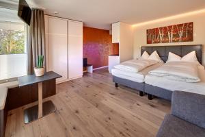 
Ein Bett oder Betten in einem Zimmer der Unterkunft Panorama Resort & Spa
