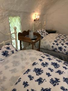 Un pat sau paturi într-o cameră la Dreamton Village