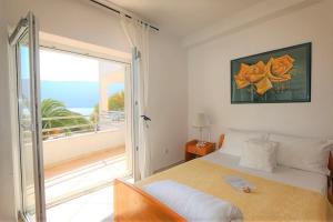Postel nebo postele na pokoji v ubytování Apartments Villa Kukoljac