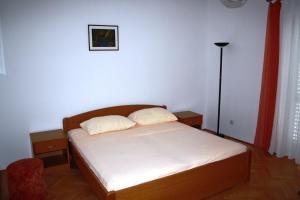 Postel nebo postele na pokoji v ubytování Apartment Pavo