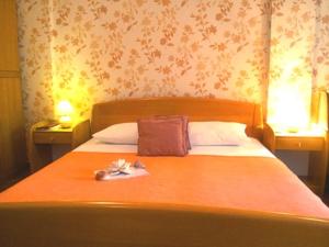 Postel nebo postele na pokoji v ubytování Apartments Villa Kukoljac