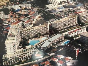 an aerial view of a city with a pool at Apartamentos Karma in Playa del Ingles