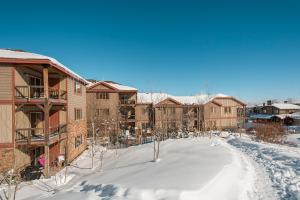arial view of an apartment complex in the snow at Bear Hollow Village in Park City