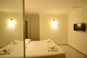 Postel nebo postele na pokoji v ubytování Hotel Aristocrat Batumi