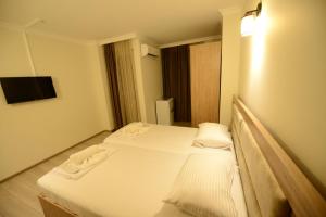 Postel nebo postele na pokoji v ubytování Hotel Aristocrat Batumi