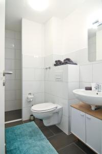 Kylpyhuone majoituspaikassa Apartmondo Ferienapartments