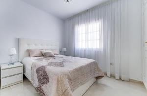 Postel nebo postele na pokoji v ubytování Villa Panoramic del Atlantico