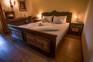Postel nebo postele na pokoji v ubytování Hotel Gasthof WASTL