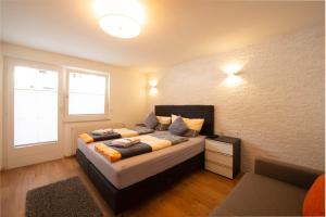 A bed or beds in a room at Ferienwohnung - Bergblick - Vandans