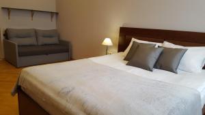 Posteľ alebo postele v izbe v ubytovaní Soprano Apartment Tamanska