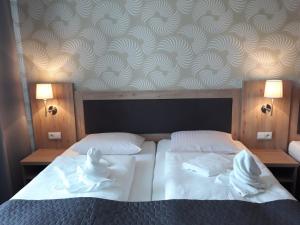 Postel nebo postele na pokoji v ubytování Hotel Rozvoj