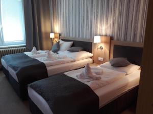 Postel nebo postele na pokoji v ubytování Hotel Rozvoj