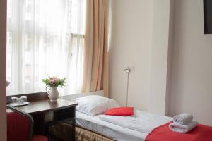 Postel nebo postele na pokoji v ubytování Atlas Berlin Hotel