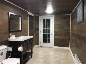 a bathroom with a sink and a toilet at Seaview White House in Stratford
