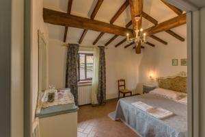 Postel nebo postele na pokoji v ubytování Casa il Castello